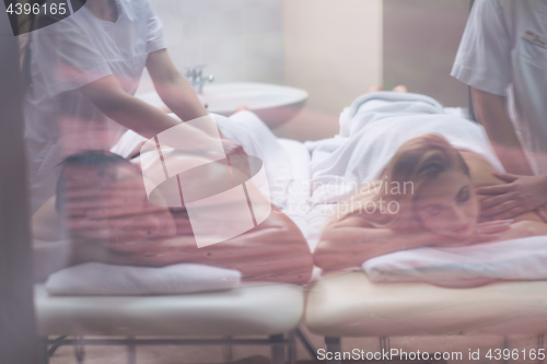 Image of couple receiving a back massage