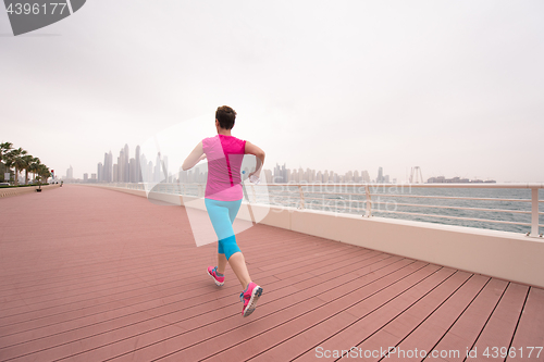 Image of woman running on the promenade