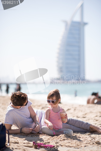 Image of Mom and daughter on the beach