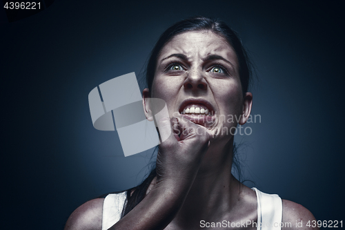 Image of Close up portrait of a crying woman with bruised skin and black eyes