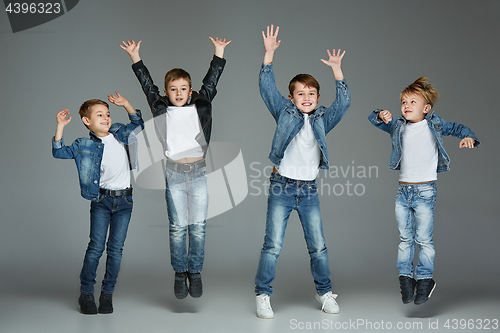 Image of Young boys jumping at studio