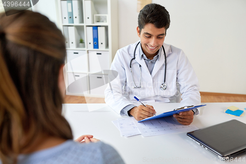 Image of doctor with clipboard and patient at hospital