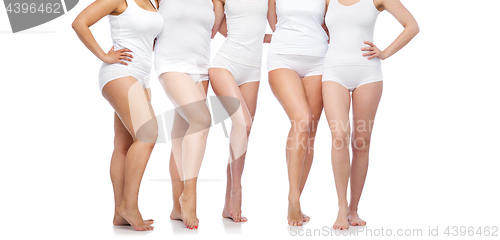 Image of group of happy diverse women in white underwear