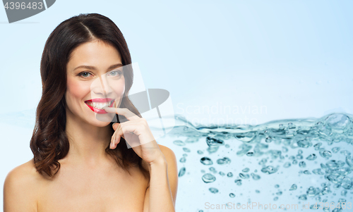 Image of beautiful smiling young woman with red lipstick