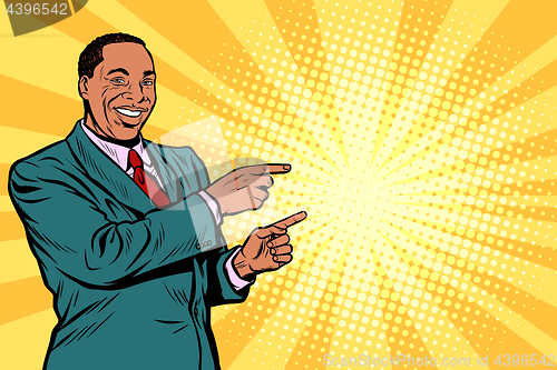 Image of African businessman pointing finger at the side