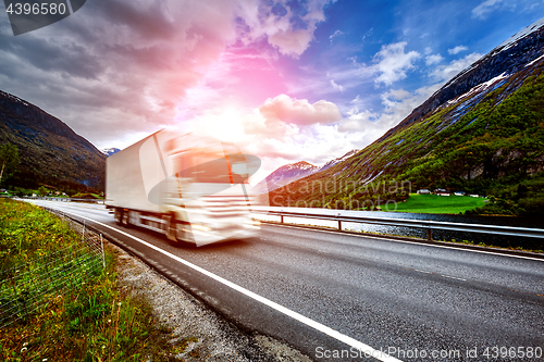 Image of Truck and highway at sunset