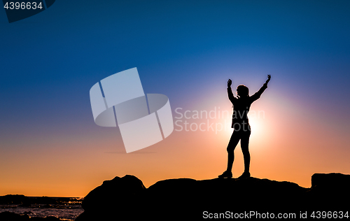 Image of Woman on top a of the rock