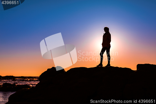 Image of Woman on top a of the rock