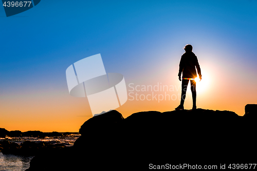 Image of Woman on top a of the rock