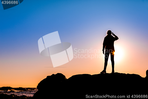 Image of Woman on top a of the rock