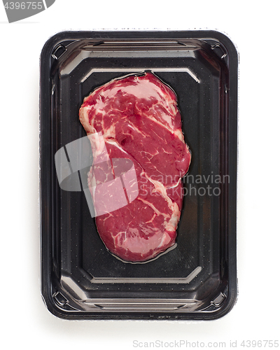 Image of raw beef steak in vacoom package