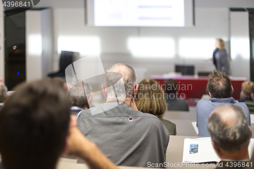 Image of Business speaker giving a talk at business conference event.