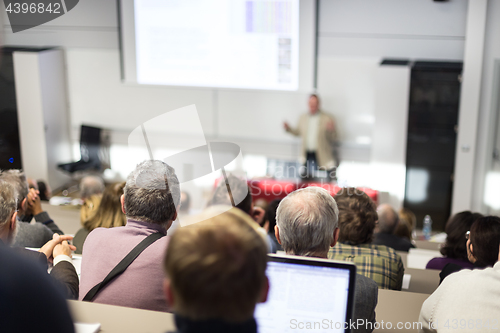 Image of Business speaker giving a talk at business conference event.