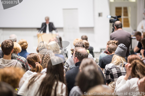 Image of Business speaker giving a talk at business conference event.