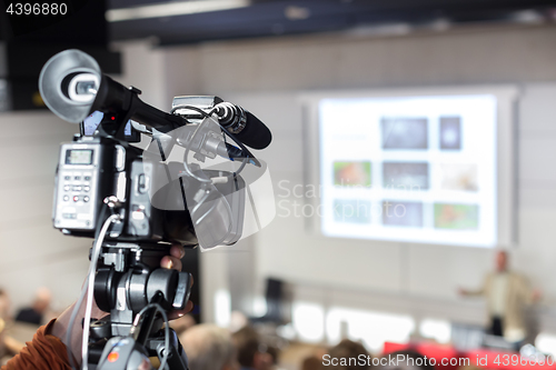 Image of Television broadcasted press conference.