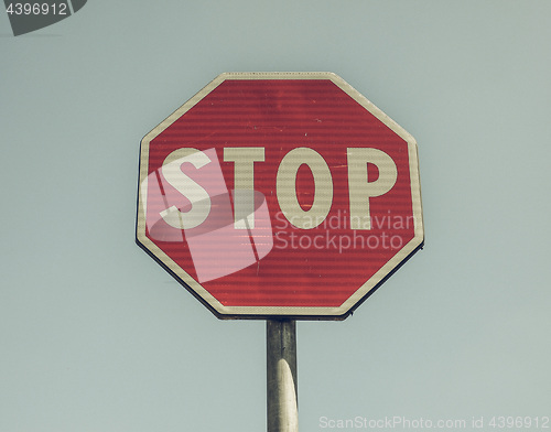 Image of Vintage looking Stop sign over blue sky