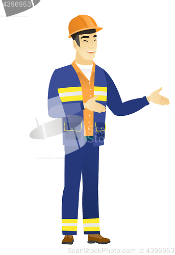 Image of Young asian happy builder gesturing.
