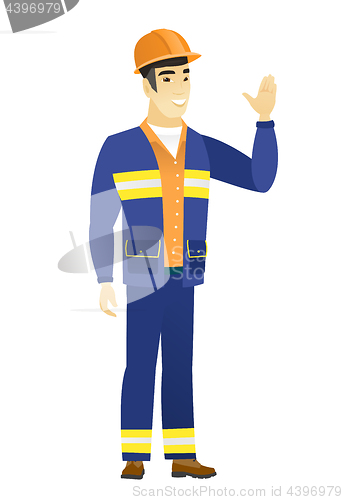 Image of Young asian builder waving his hand.