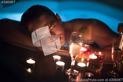 Image of man relaxing in the jacuzzi