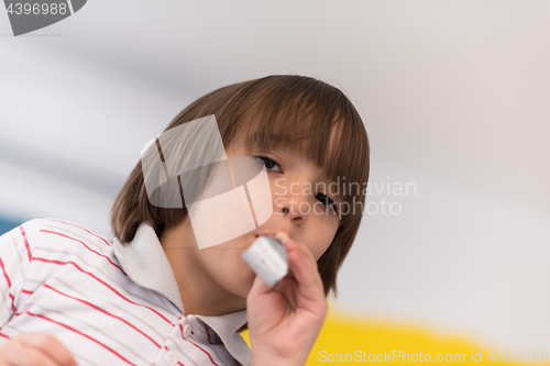 Image of kid blowing a noisemaker