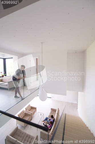 Image of family with little girl enjoys in the modern living room