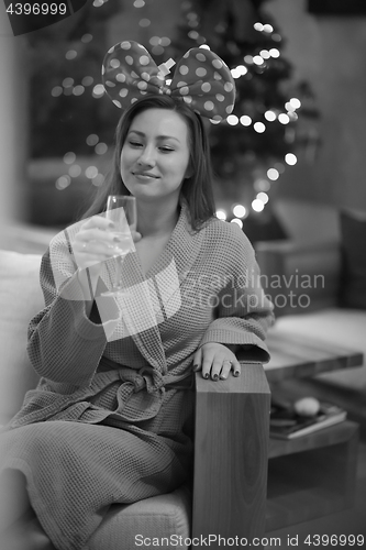 Image of woman drinking champagne at spa