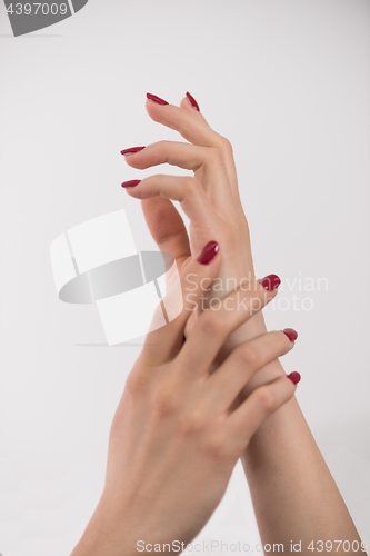 Image of closeup of hands of a young woman