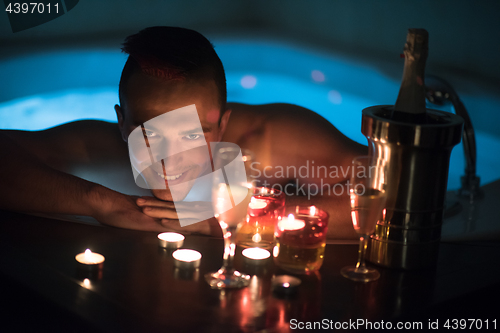 Image of man relaxing in the jacuzzi