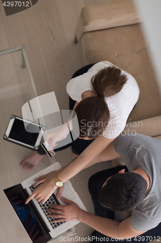 Image of happy young couple buying online