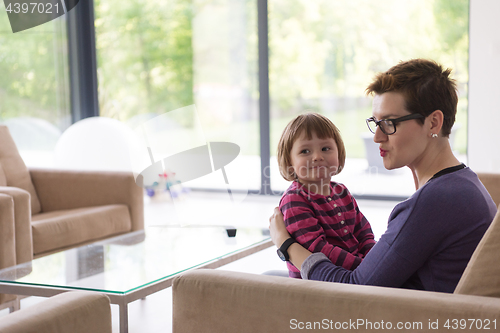 Image of mother and cute little girl enjoying their free time