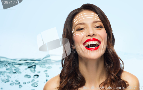 Image of beautiful laughing woman with face lifting arrows