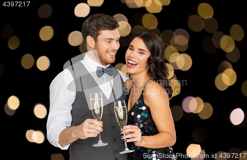 Image of happy couple with champagne glasses at party