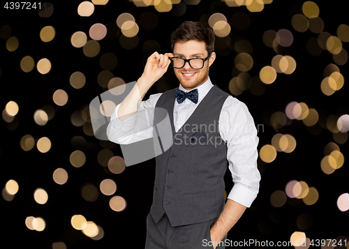 Image of happy man in festive suit and eyeglasses