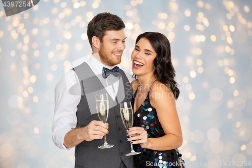 Image of happy couple with champagne glasses at party