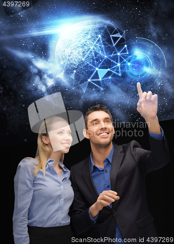 Image of businessman and businesswoman over space