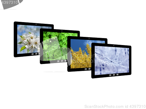 Image of four tablet computers with images of seasons