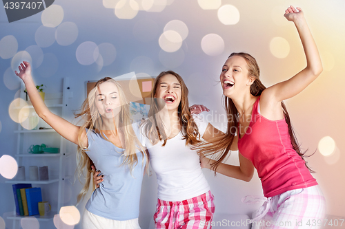 Image of happy friends or teen girls having fun at home