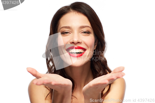 Image of beautiful smiling young woman with red lipstick