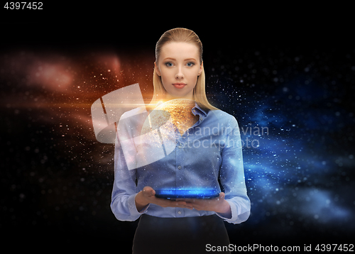 Image of businesswoman with tablet pc and space hologram