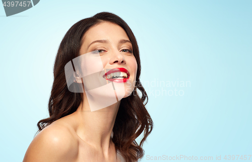 Image of beautiful smiling young woman with red lipstick