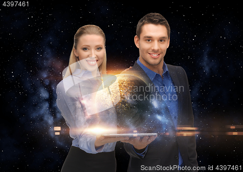 Image of businesspeople with tablet pc and planets in space