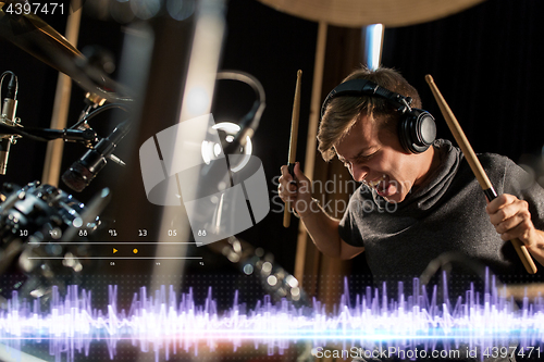 Image of musician playing drums at sound recording studio