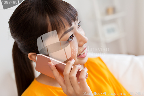 Image of close up of asian woman calling on smartphone