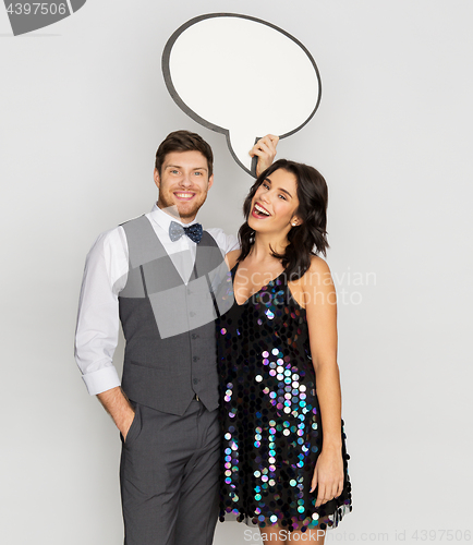 Image of happy couple at party holding text bubble banner