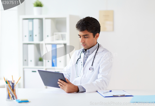 Image of doctor with tablet pc and stethoscope at clinic