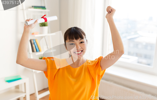 Image of happy student girl with diploma at home