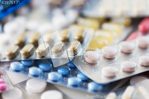 Image of different pills and capsules of drugs