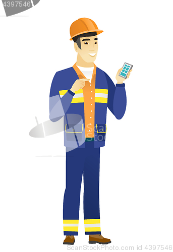 Image of Asian builder holding a mobile phone.