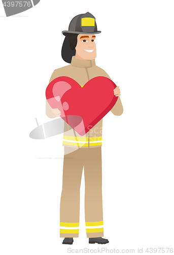 Image of Caucasian firefighter holding a big red heart.