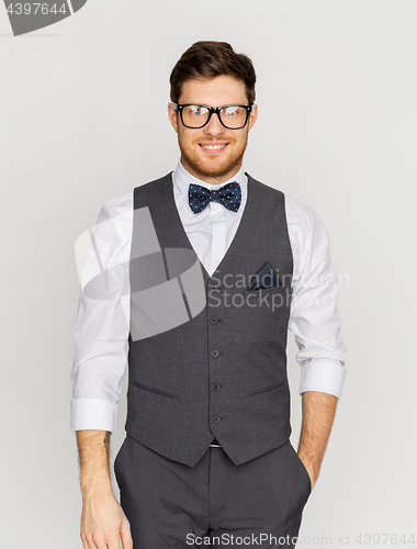 Image of happy man in festive suit and eyeglasses